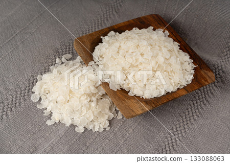 Raw flattened rice isolated. Dry rice flakes or poha, Indian breakfast food 133088063