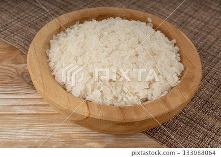 Raw flattened rice. Dry rice flakes or poha, Indian breakfast food 133088064