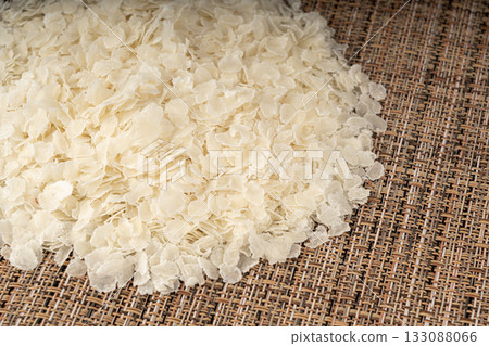 Raw flattened rice. Dry rice flakes or poha, Indian breakfast food 133088066