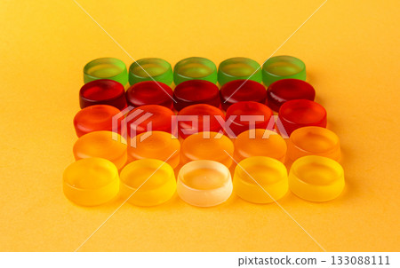 Round gummy candy pile. Chewing colorful marmalade pills, jelly gumdrops heap 133088111