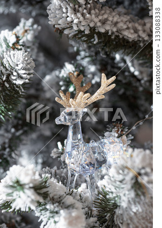 Crystal Reindeer with Gold Antlers Ornament on Snow-Flocked Christmas Tree 133088338