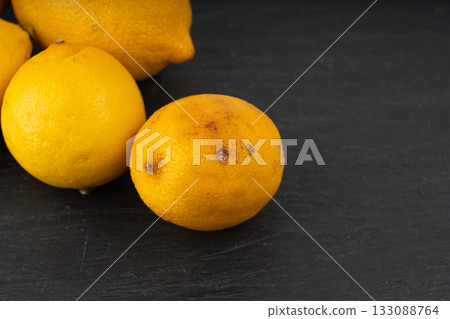 Old dried lemons. Fruits with darkened skins 133088764
