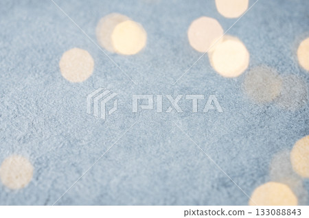 Christmas lights with a bokeh effect on a light blue background. 133088843