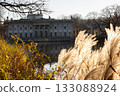 Palace on the Isle reflected in water, Lazienki Park Warsaw  autumn sunlight 133088924