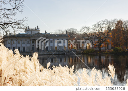Palace on the Isle reflected in water Lazienki Park Warsaw autumn sunlight Palace on the Isle reflected in water Lazienki Park Warsaw autumn sunlight 133088926