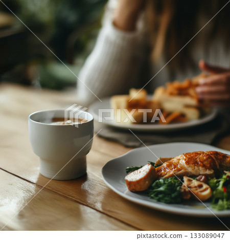 An alarm clock marks the moment for a meal during an intermittent fasting routine in a warm and inviting kitchen An alarm clock marks the moment for a meal during an intermittent fasting routine in a warm and inviting kitchen 133089047