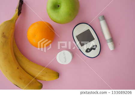 Healthy snack options and diabetes testing kit on table Healthy snack options and diabetes testing kit on table 133089206