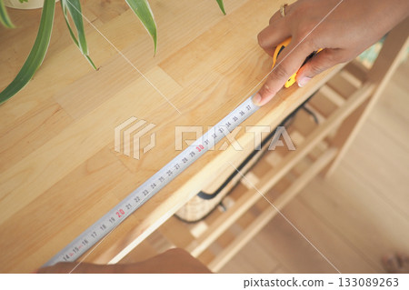 Measuring wood surface in home for project planning Measuring wood surface in home for project planning 133089263