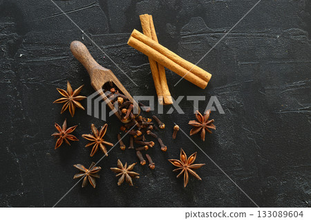 Cinnamon, cloves and star anise. Different spices set on black background. Selective focus. Cinnamon, cloves and star anise. Different spices set on black background. Selective focus. 133089604