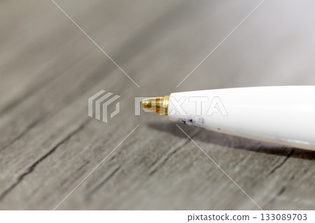 Close-up of a ballpoint pen lying on a table Close-up of a ballpoint pen lying on a table 133089703