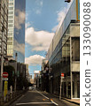 Shinjuku's anime-like alleyway with big clouds and blue skies 133090088