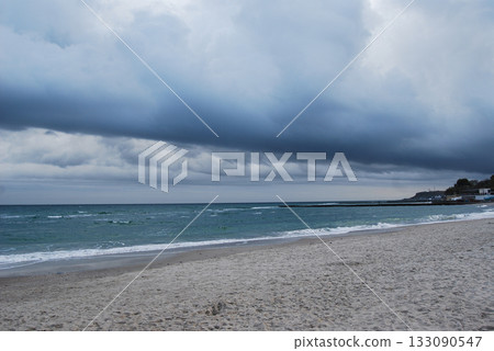 Beautiful seascape of the Black Sea. A seascape of the Black Sea with gentle waves lapping a sandy beach. Beautiful seascape of the Black Sea. A seascape of the Black Sea with gentle waves lapping a sandy beach. 133090547
