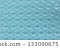 Cushioning material on light blue paper 133090675