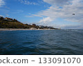 Beautiful seascape of the Black Sea. A seascape of the Black Sea with gentle waves lapping a sandy beach. 133091070