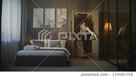 Hotel Maid Entering Elegant Hotel Room With Breakfast Trolley. 133091758