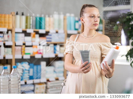 Pregnant woman are busy choosing emollient cream at pharmacy Pregnant woman are busy choosing emollient cream at pharmacy 133093677