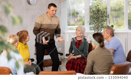 Man leading education class for group of elderly people Man leading education class for group of elderly people 133094040