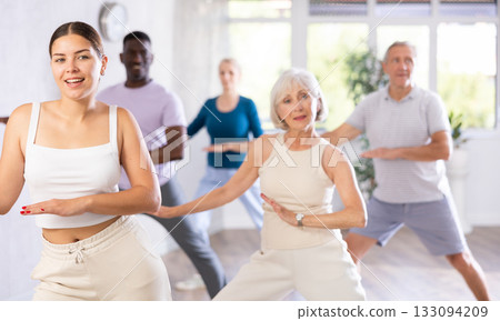 Men and women of different ages practicing Hip-hop dance in training hall Men and women of different ages practicing Hip-hop dance in training hall 133094209