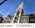 The magnificent sight of Munich's New Town Hall and the French flag against the blue sky 133094811