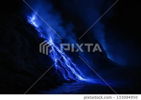 Blue lava glowing at night, a fantastic sight of a volcano 133094950