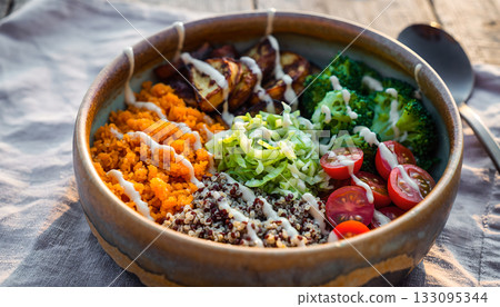 Delicious and nutritious power bowl featuring vibrant vegetables roasted potatoes quinoa and 133095344