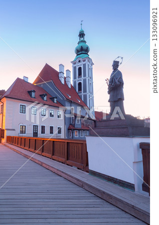 Statue and church tower at sunrise, Cesky Krumlov, Czech Republic 133096921