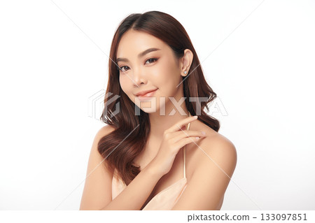 A beautiful young Asian woman with clean, fresh skin against a white background. Skincare, facial treatment, cosmetology, beauty, and spa. An elegant portrait of an Asian woman. A beautiful young Asian woman with clean, fresh skin against a white background. Skincare, facial treatment, cosmetology, beauty, and spa. An elegant portrait of an Asian woman. 133097851