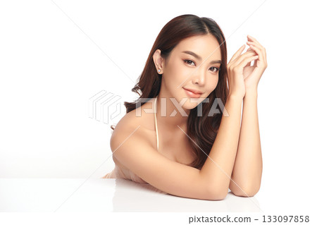 A beautiful young Asian woman with clean, fresh skin against a white background. Skincare, facial treatment, cosmetology, beauty, and spa. An elegant portrait of an Asian woman. A beautiful young Asian woman with clean, fresh skin against a white background. Skincare, facial treatment, cosmetology, beauty, and spa. An elegant portrait of an Asian woman. 133097858