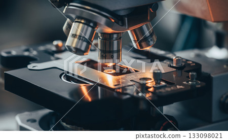 Close up shot demonstrating research through microscopy reveals detail into biomedical science and 133098021