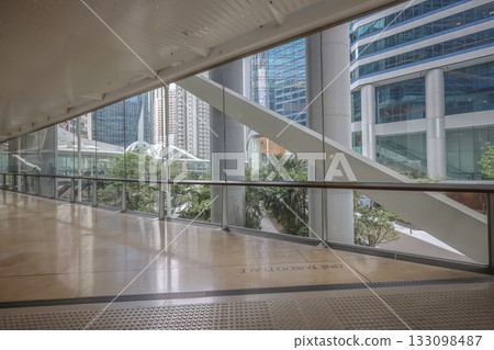 Oct 29 2025 Bright Modern Office Corridor With Glass Walls, Beige Tile Floor Oct 29 2025 Bright Modern Office Corridor With Glass Walls, Beige Tile Floor 133098487