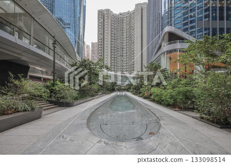 Oct 29 2025 Urban Plaza With Water Channel, Greenery And Glass Skyscraper Oct 29 2025 Urban Plaza With Water Channel, Greenery And Glass Skyscraper 133098514