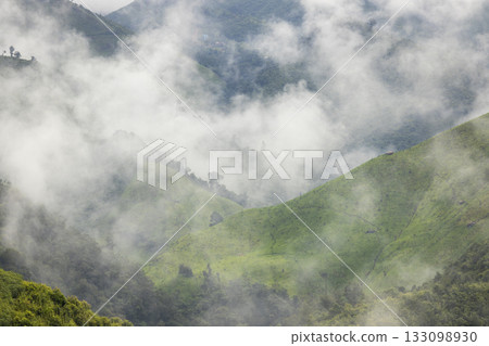Landscape of Morning Mist with Mountain Layer at north of Thailand. mountain ridge and clouds in rural jungle bush forest Landscape of Morning Mist with Mountain Layer at north of Thailand. mountain ridge and clouds in rural jungle bush forest 133098930