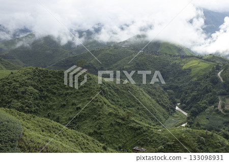 Landscape of Morning Mist with Mountain Layer at north of Thailand. mountain ridge and clouds in rural jungle bush forest Landscape of Morning Mist with Mountain Layer at north of Thailand. mountain ridge and clouds in rural jungle bush forest 133098931
