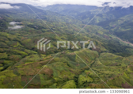 Landscape of Morning Mist with Mountain Layer at north of Thailand. mountain ridge and clouds in rural jungle bush forest Landscape of Morning Mist with Mountain Layer at north of Thailand. mountain ridge and clouds in rural jungle bush forest 133098961