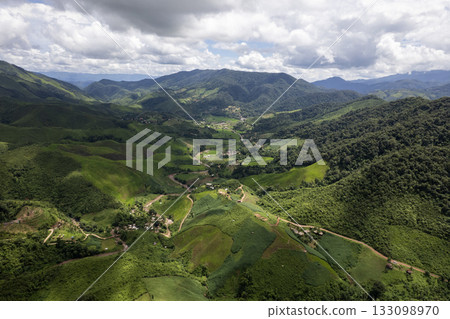 Landscape of Morning Mist with Mountain Layer at north of Thailand. mountain ridge and clouds in rural jungle bush forest Landscape of Morning Mist with Mountain Layer at north of Thailand. mountain ridge and clouds in rural jungle bush forest 133098970