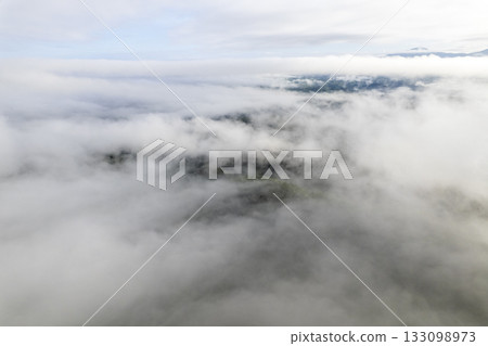 Landscape of Morning Mist with Mountain Layer. mountain ridge and clouds in rural jungle bush forest Landscape of Morning Mist with Mountain Layer. mountain ridge and clouds in rural jungle bush forest 133098973