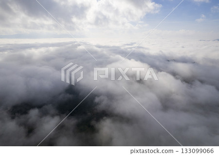 Landscape of Morning Mist with Mountain Layer. mountain ridge and clouds in rural jungle bush forest Landscape of Morning Mist with Mountain Layer. mountain ridge and clouds in rural jungle bush forest 133099066