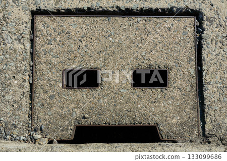 The inorganic look of concrete: a close-up of a drain cover The inorganic look of concrete: a close-up of a drain cover 133099686