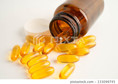 Fish oil or Cod liver oil gel in capsules with omega 3 vitamins, supplementary healthy food. 133099745