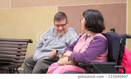 Diverse people conversing outdoors, promoting inclusion 133099997