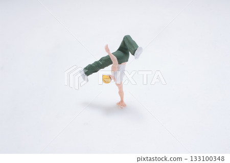 Miniature Figure Doing Handstand on One Hand, 133100348