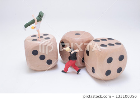 Miniature Figures on Large Wooden Dice in Playful Fitness Miniature Figures on Large Wooden Dice in Playful Fitness 133100356