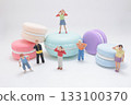 a Playful Miniature People Explore Colorful Macarons 133100370