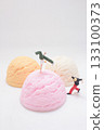 Playful Miniature Figures Perform Acrobatics on Colorful Ice Cream 133100373