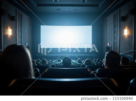 Image of a cinema screen and audience seen from behind 133100940