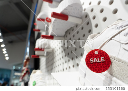 White sneakers on sale display in store White sneakers on sale display in store 133101160