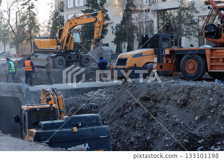 Urban Construction Site with Heavy Machinery 133101198