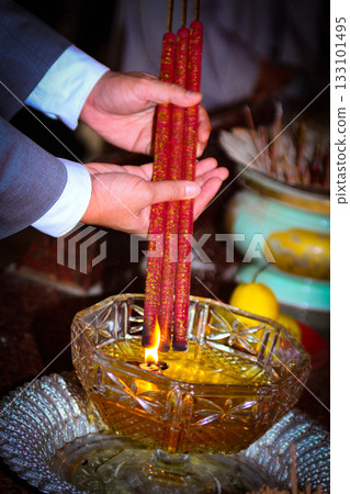 Pray in a Temple as Incense Sticks Burn, Creating a Colorful Ceremonial Scene,Chinese prayer, Chinese new year prayers Pray in a Temple as Incense Sticks Burn, Creating a Colorful Ceremonial Scene,Chinese prayer, Chinese new year prayers 133101495