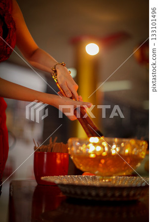 Pray in a Temple as Incense Sticks Burn, Creating a Colorful Ceremonial Scene,Chinese prayer, Chinese new year prayers 133101496