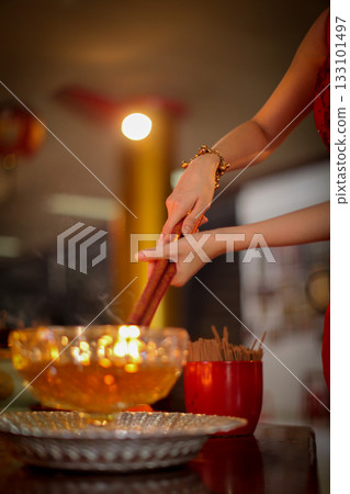 Pray in a Temple as Incense Sticks Burn, Creating a Colorful Ceremonial Scene,Chinese prayer, Chinese new year prayers 133101497